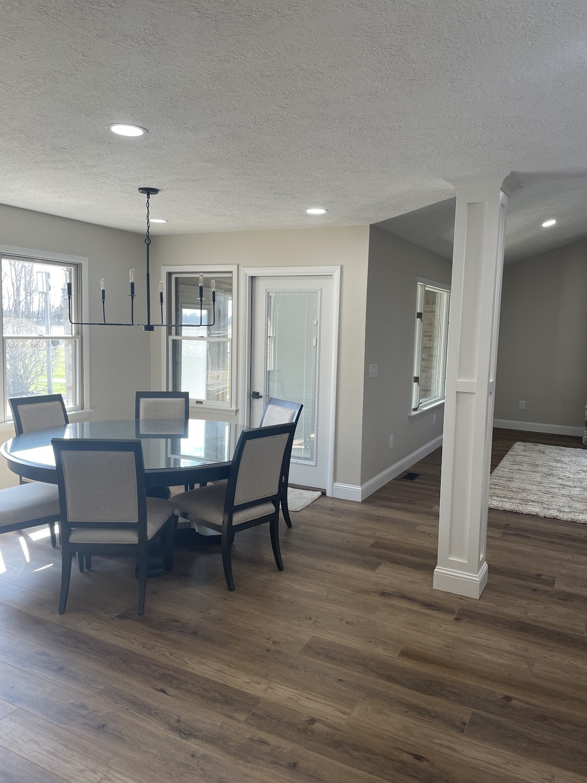 Dining area painted light grey with crisp white trim